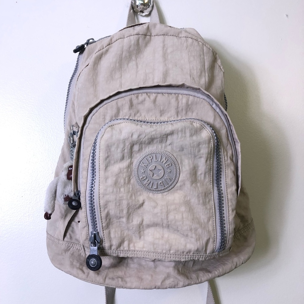 Kipling expandable backpack beige. No monkey chain